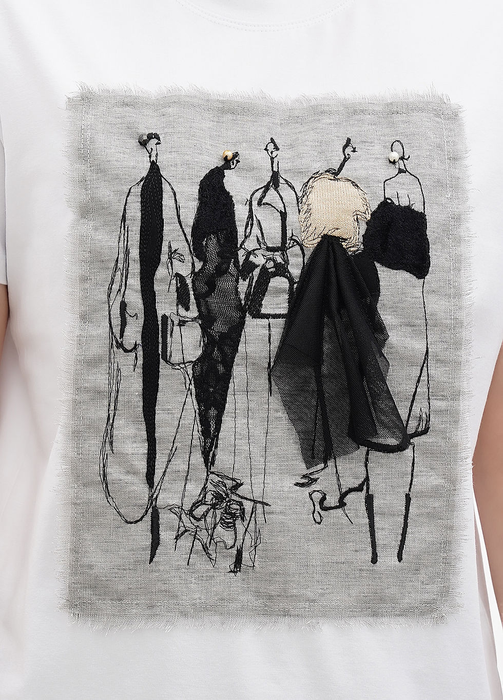 Прев'ю: Female model wearing a designer t-shirt with a vibrant graphic.