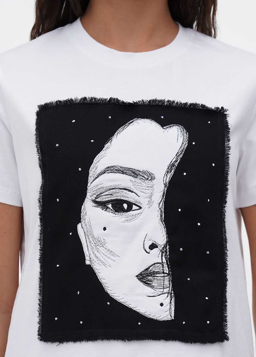 Прев'ю: Female model wearing a designer t-shirt with a vibrant graphic.