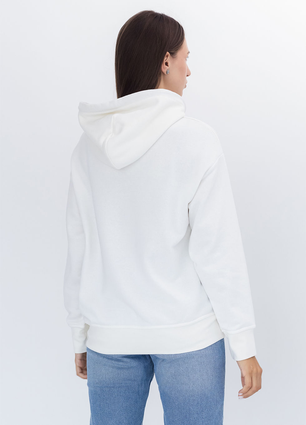 Female model wearing a designer hoodie with a vibrant graphic