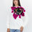Thumbnail: Female model wearing a designer sweatshirt with a vibrant graphic.