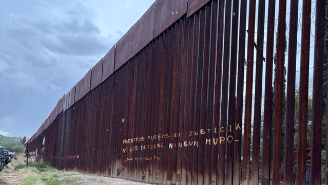"Our dreams of justice are not stopped by any wall," Mexican side of wall, Nogales Sonora, photo by Kaitlin O'Meara
