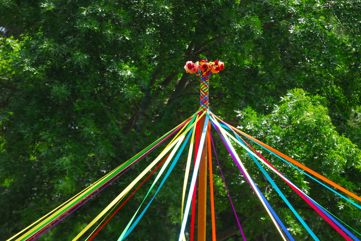 Image of a partially woven Beltane May Pole