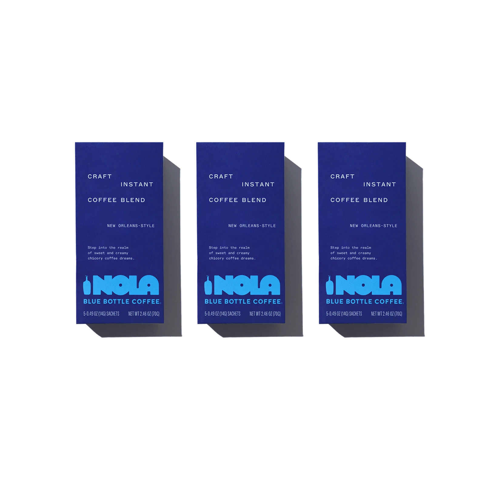 Three Blue boxes that say NOLA instant coffee