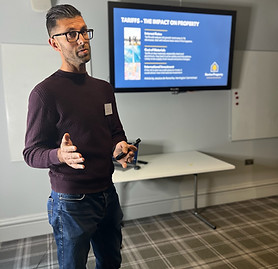 Milesh Lakhani speaking at a property and business event