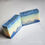 Thumbnail: Two handmade soap bars with a blue and yellow gradient sky over a dark blue mountain silhouette