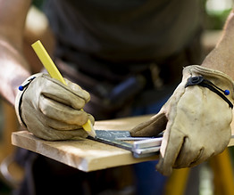 Carpenter Measuring Wood