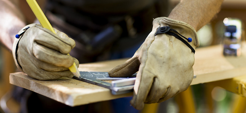 Carpenter Measuring Wood