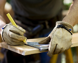 Carpenter Measuring Wood