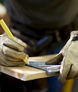 Carpenter Measuring Wood