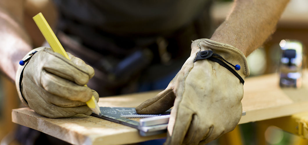 Carpenter Measuring Wood
