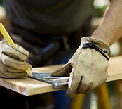 Carpenter Measuring Wood