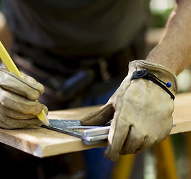 Carpenter Measuring Wood