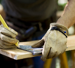 Carpenter Measuring Wood