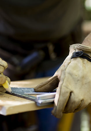 Carpenter Measuring Wood