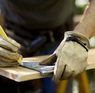 Carpenter Measuring Wood