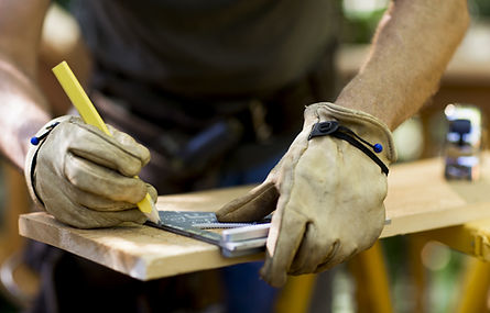 Carpenter Measuring Wood