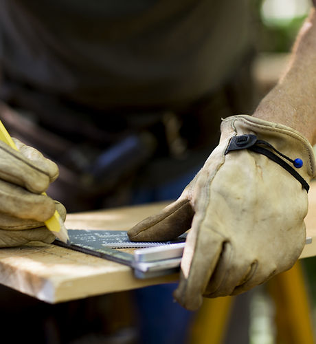 Carpenter Measuring Wood
