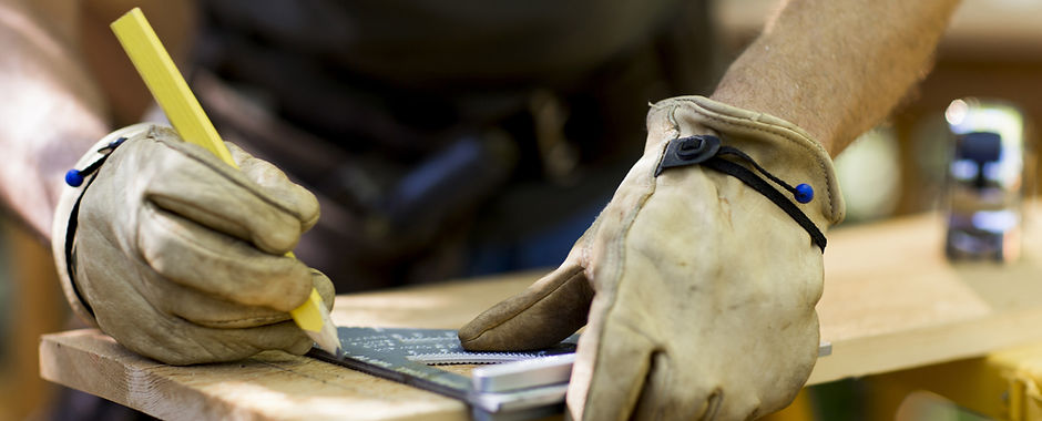 Carpenter Measuring Wood
