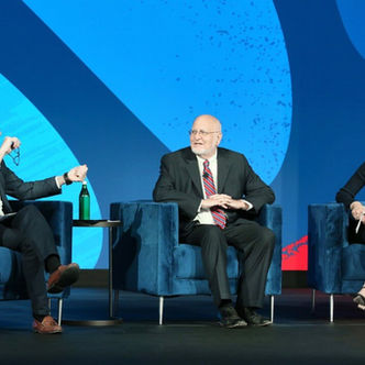 Seema Verma sitting for a fireside chat with two other individuals at the Oracle Health Summit 2024