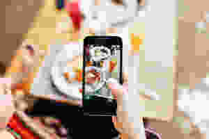 cell phone taking picture of meal
