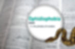 Close-up of a dictionary with the word "Ophidiophobia" defined as "the phobia of snakes." A snake is partially visible.