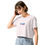 Thumbnail: Woman in white "lowNfast" drop-shoulder T-shirt