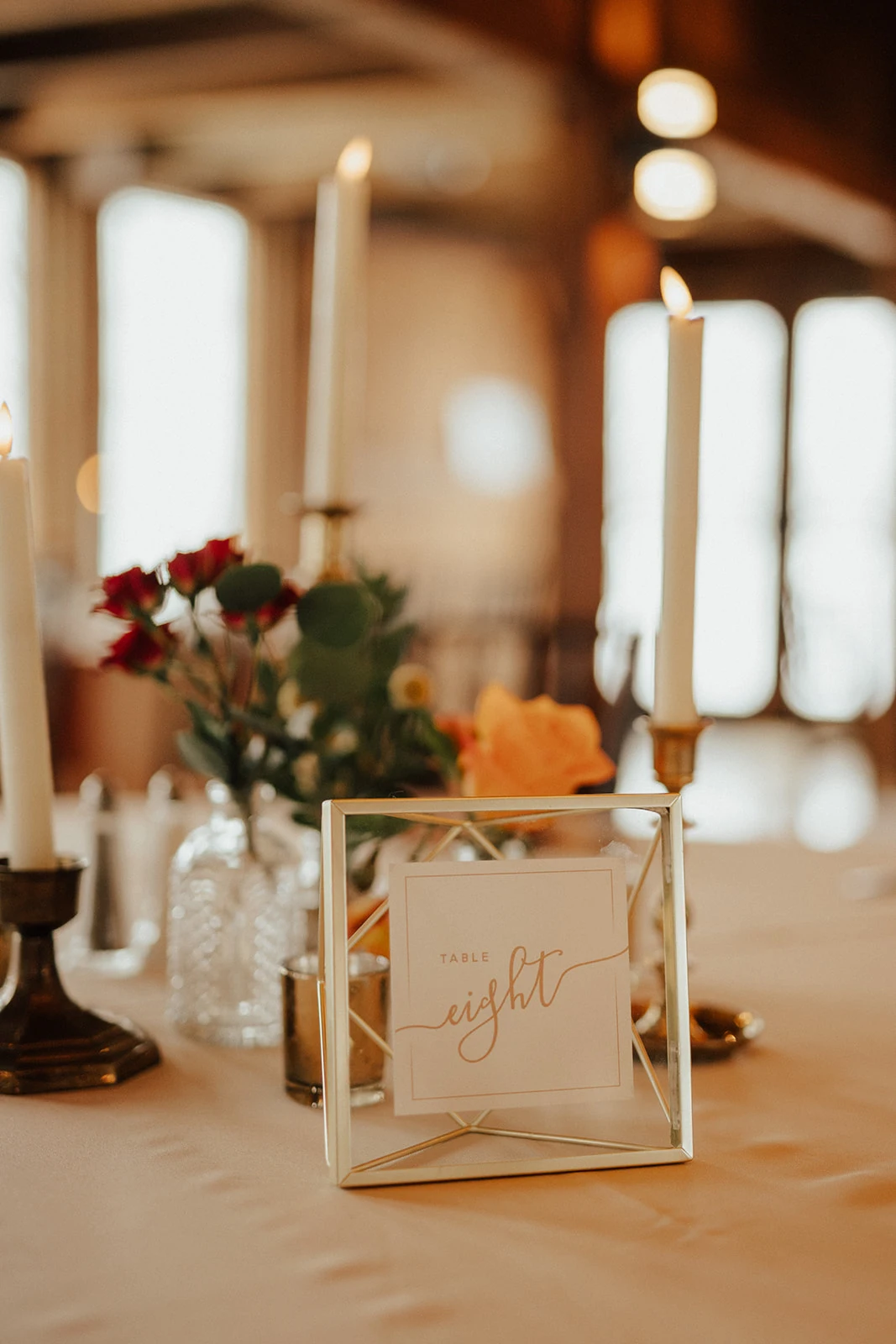 Elegant wedding place setting featuring ivory linens, terracotta napkins, and a custom thank you card at The Barn at Silverstone, a luxury wedding venue in Lancaster, PA.