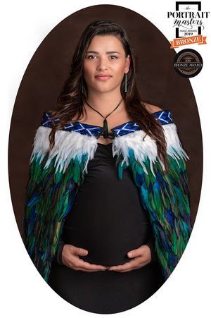 Maternity Portrait of an Expectant Mother wearing her Whanau Korowait that received a Bronze Award in the International Portrait Masters Awards and in the RISE Awards, photograph by Christchurch Family and Contemporary Portrait Photographer Kirsten Naomi Photography