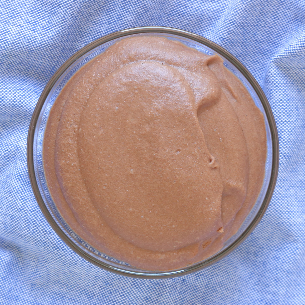 Glass bowl of Chocolate Whirl resting on a light blue fabric background