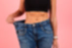 woman-holding-oversized-jeans-in-front-of-body-2026-03-24-01-30-47-utc.jpg