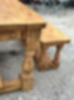 Reclaimed pine dining table with wine box drawer and matching bench end view
