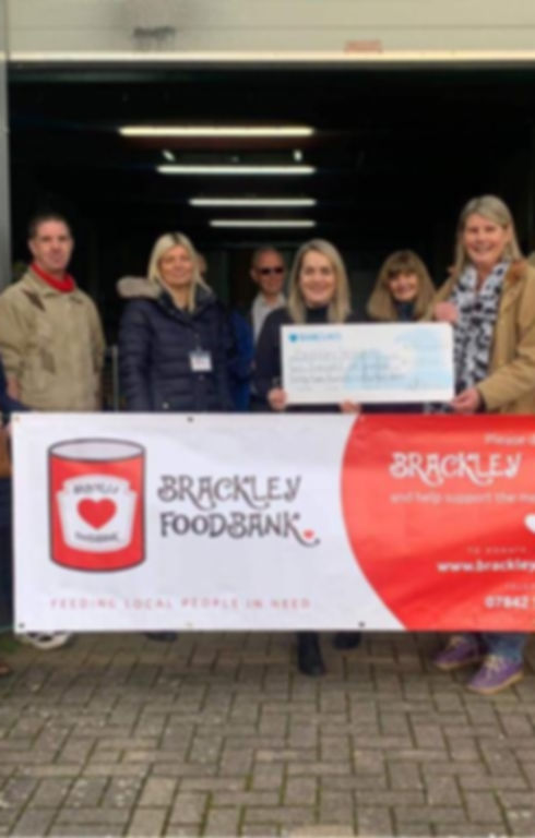 Brackley Foodbank receiving a gift