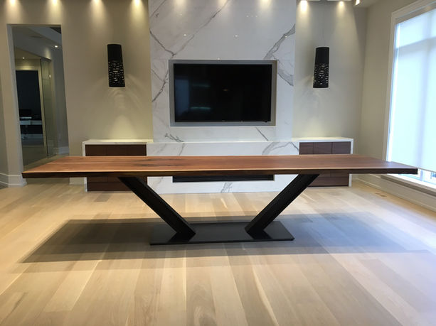 Cherrywood Studio live edge black walnut dining table featuring a railroad track and steel base, handcrafted in Ontario and showcased in a modern Toronto home.