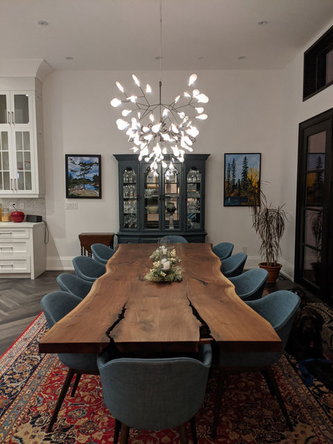 Cherrywood Studio black walnut dining table with a custom railroad track steel base, handcrafted for a modern dining space in Newmarket, Ontario