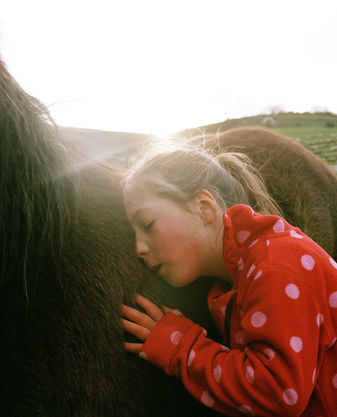 child in red fleece