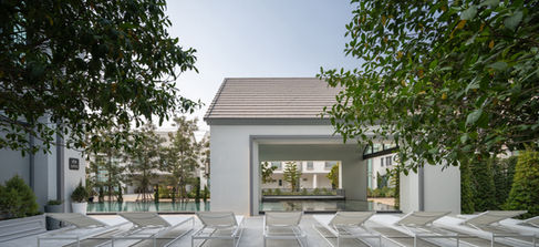 poolside lounge surrounded by greenery at Baranee Bliss