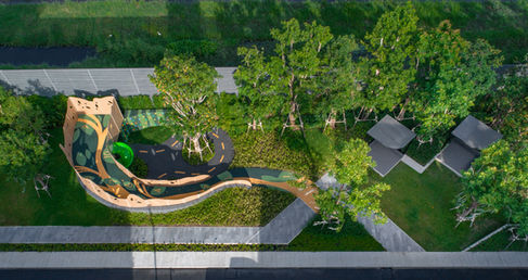 Aerial view of Vana Tree House Playground at Vana Residence showing organic ground patterns, treehouse form, and landscape design by VV Desine.