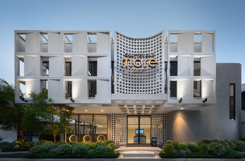 Evening front view with lighting and greenery at Chapter One Kaset.