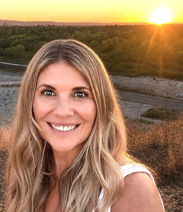 Image of woman at sunset near river bed