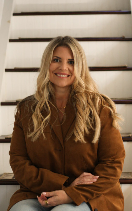 Cathi Workman sitting on stairs