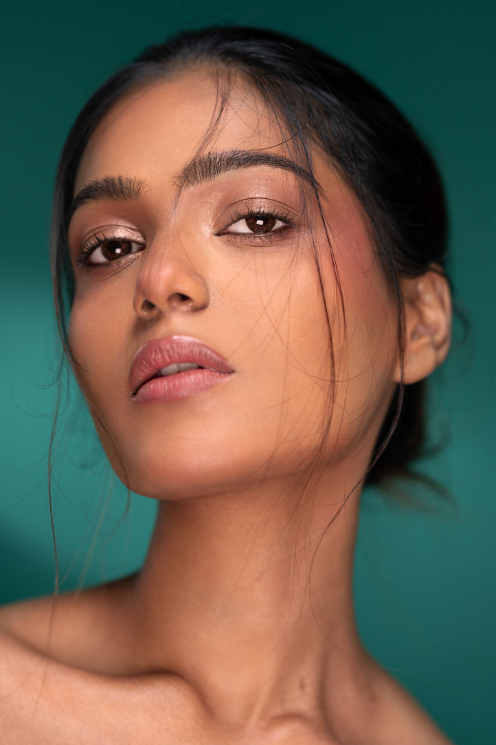 Close-up portrait of a woman with glowing makeup