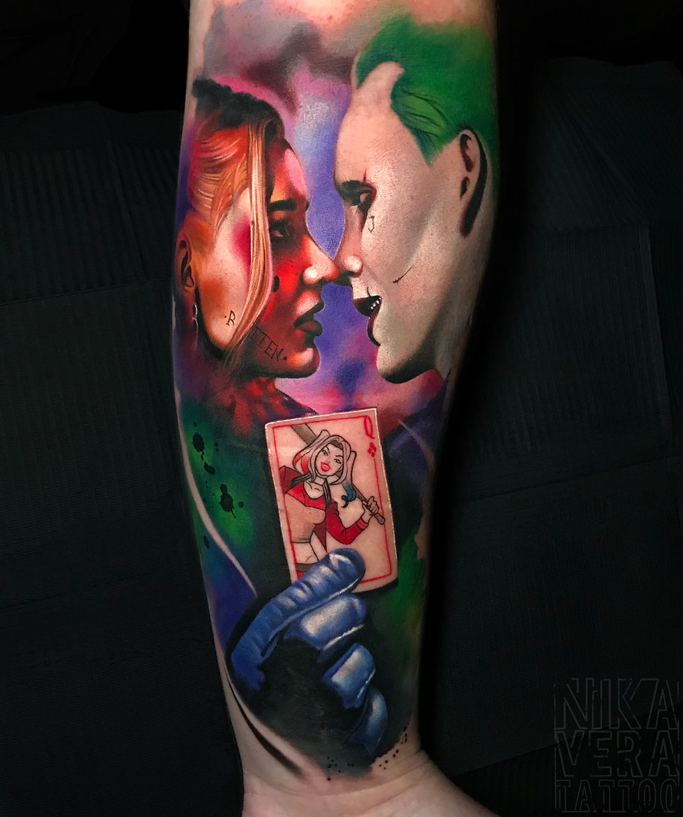 joker and harley queen kiss tattoo on forearm