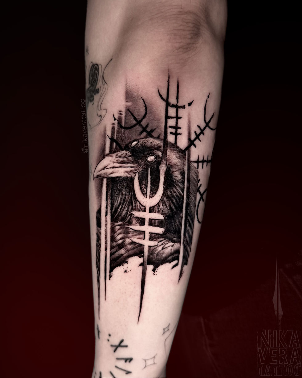 raven with viking symbols on forearm