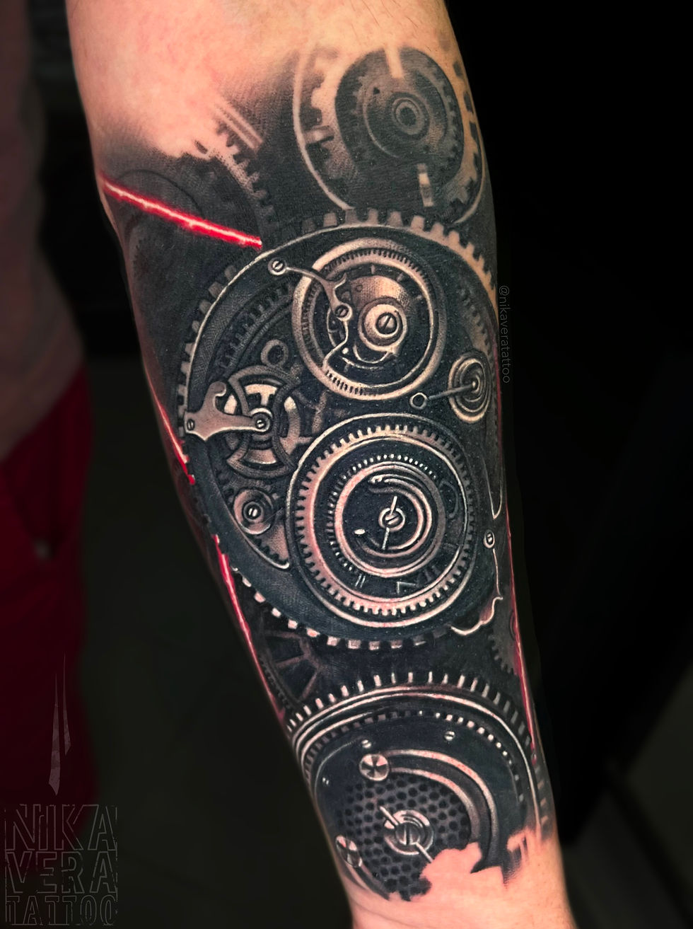 bio mechanical tattoo on forearm