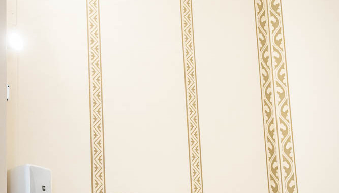 This is where the angel mural will be placed within these five frames on the wall.