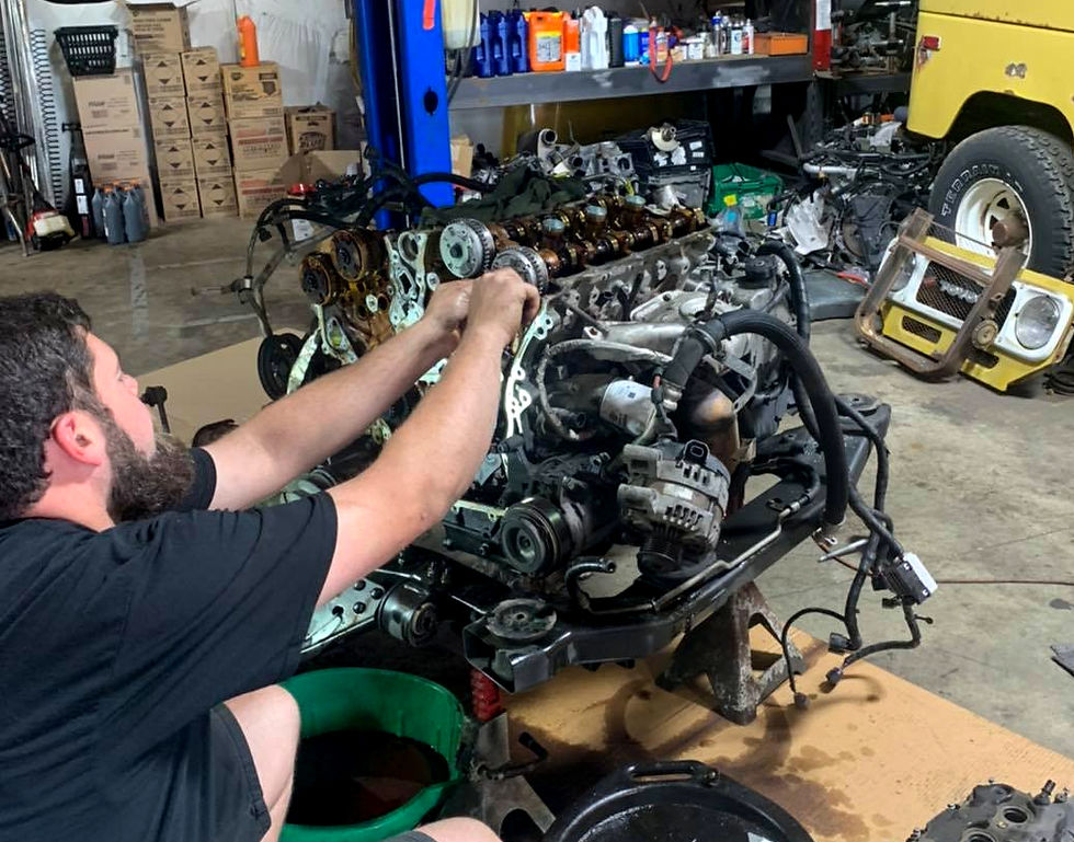guy fixing an engine