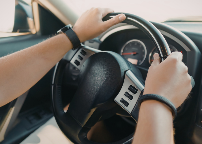 hands over steering wheel