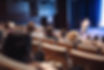 woman-giving-presentation-business-conference-event.jpg