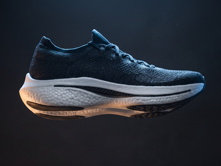 Advanced athletic running shoe with carbon plate and foam midsole in profile