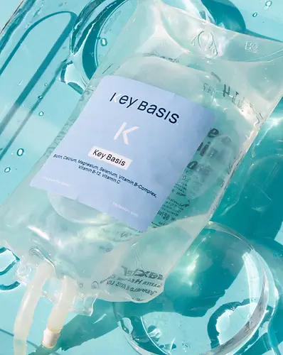 A Key Basis IV drip bag resting in clear water
